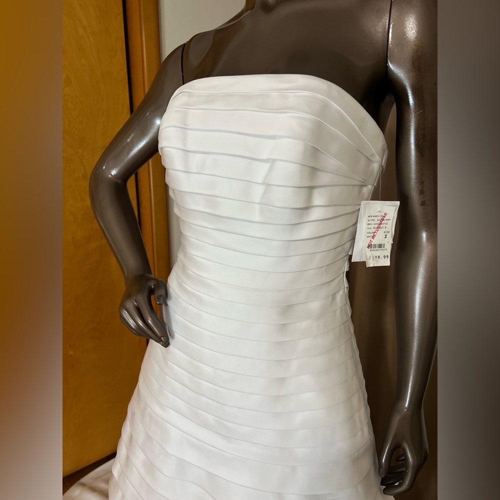Christian Michele style 4043 white A-line wedding gown.